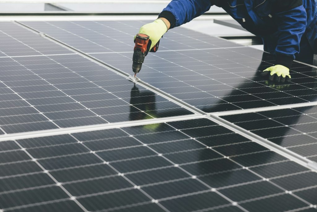 Installer fixing solar panels